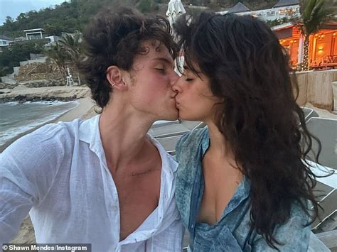 Camila Cabello and boyfriend Shawn Mendes share a passionate kiss as ...