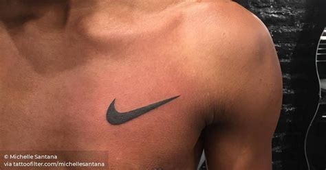 Nike Logo tattoo on the left side of the chest.