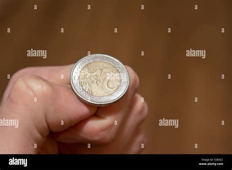 Tossing Euro coin, heads or tails you decide Stock Photo - Alamy