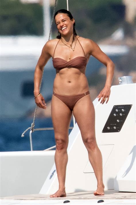 Michelle Rodriguez shows off her bikini body as she soaks up the sunshine on a yacht while ...