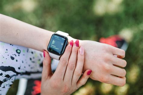 Person Wearing White Sports Band Apple Watch · Free Stock Photo