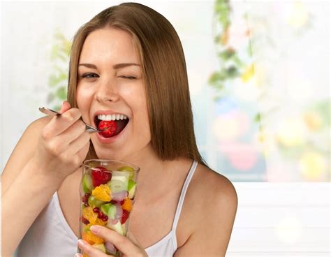 Premium Photo | Eating women fruit healthy eating healthy lifestyle salad people