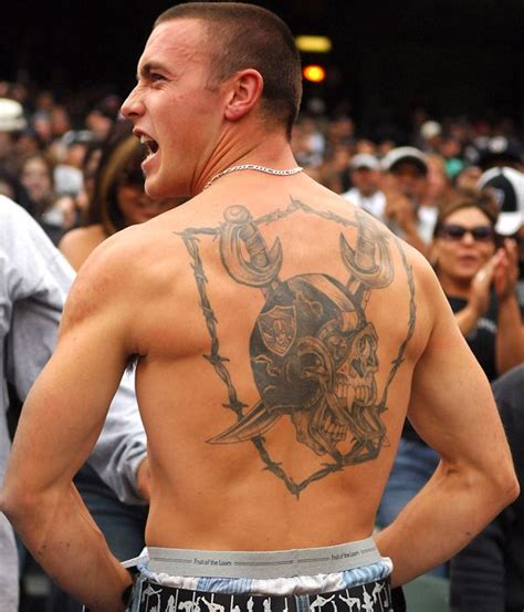 Fans and Their Sports Tattoos - SI.com Photos | Oakland raiders fans, Raiders tattoos, Raiders fans