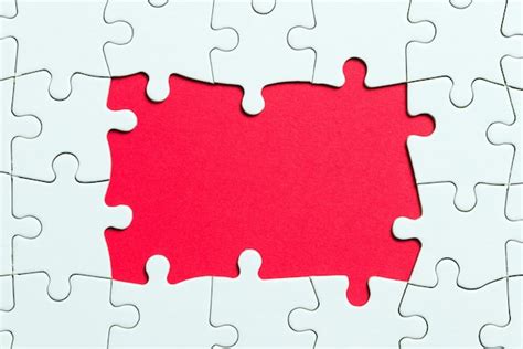 Premium Photo | Jigsaw puzzle game piece on red background for business theme design