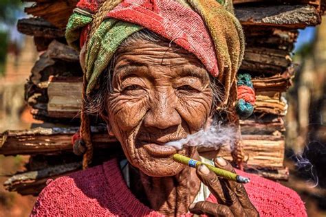 Old woman smoking a cheroot cigar, Myanmar | Insight Guides Blog