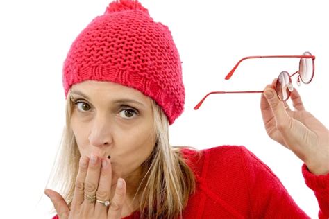 Premium Photo | Portrait of woman wearing hat while blowing kiss against white background