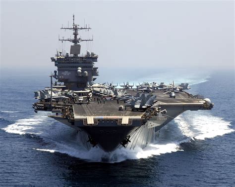 an aircraft carrier in the middle of the ocean