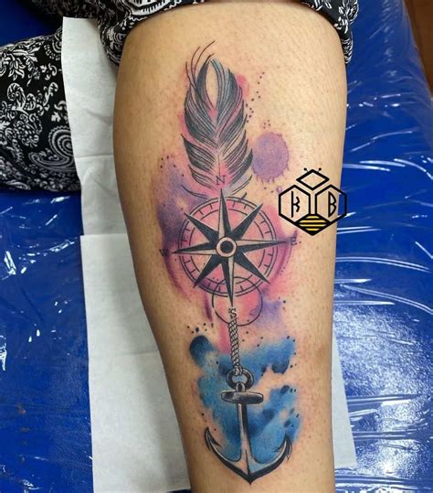 Compass With Feather Tattoo Designs