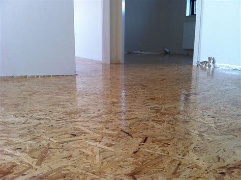 Oriented strand board as our wooden floor. With 3 layers of varnish. Osb floor / osb vloer ...