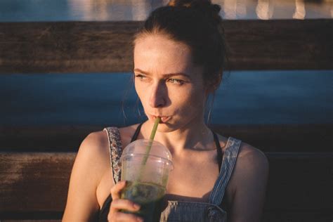Woman Drinking Sipping on Plastic Cup · Free Stock Photo