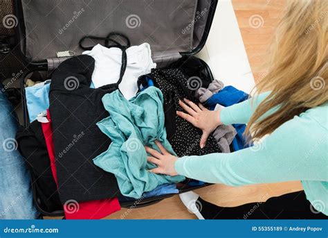 Woman Packing Clothes in Suitcase Stock Image - Image of holding, open ...