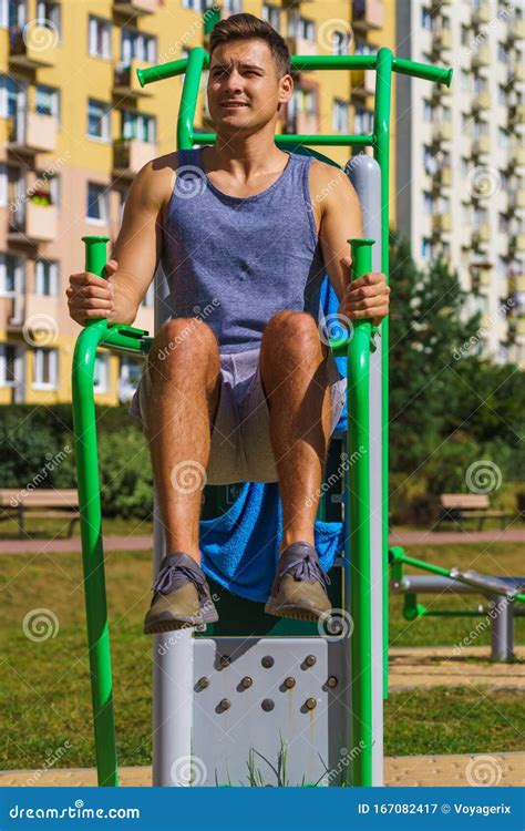 Man Doing Sit Ups in Outdoor Gym Stock Image - Image of athletic, outdoor: 167082417