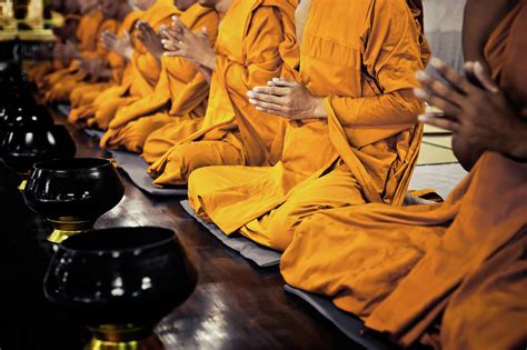 Buddhist Monks Praying Photograph by Fredfroese