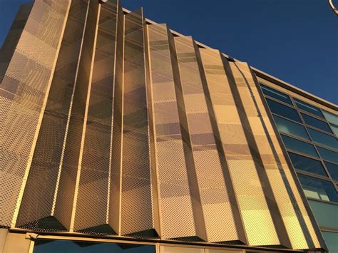 Folded perforated panels provide shade and look great. | Metal facade, Facade architecture ...