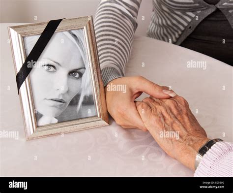 Holding hands comfort grief death hi-res stock photography and images - Alamy