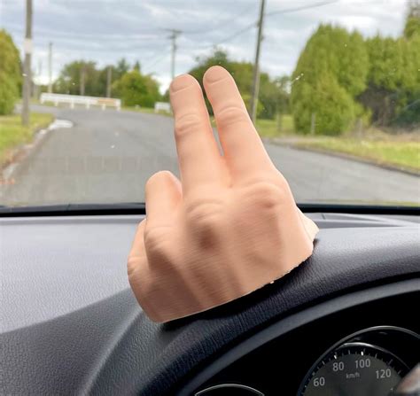 This 2-Finger Waving Hand Mounts To Your Dashboard, Never Miss Another ...