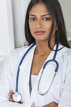 An Indian Asian Female Medical Doctor Thinking In Her Hospital Office Background, India, White ...