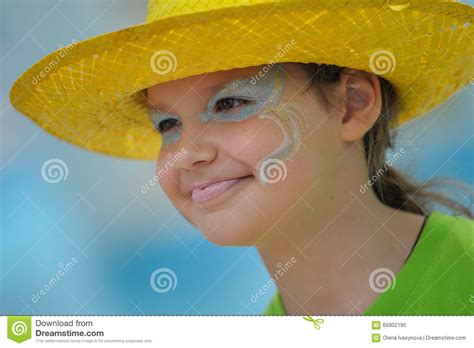 A Little Girl in a Bright Yellow Hat Stock Photo - Image of child, elementary: 66902190