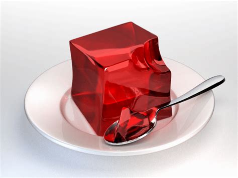 a red cube on a white plate with a spoon