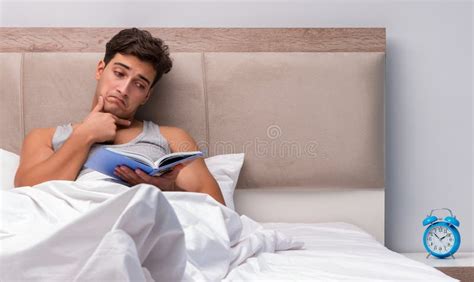 Man Reading Book in the Bed Stock Image - Image of restless, night: 174268149