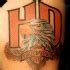 Beautiful logo of harley davidson tattoo on shoulder - Tattooimages.biz