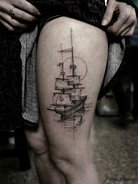 Sketch work style sailing ship tattoo on the left