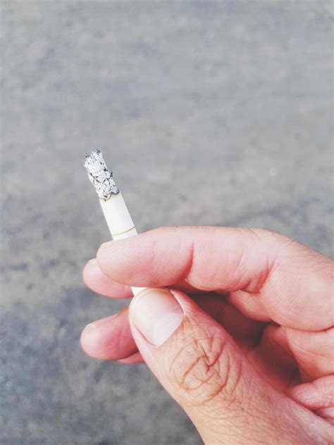 Hand With Cigarette Stock Photos, Images and Backgrounds for Free Download