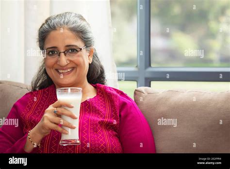 Woman smile milk hi-res stock photography and images - Alamy