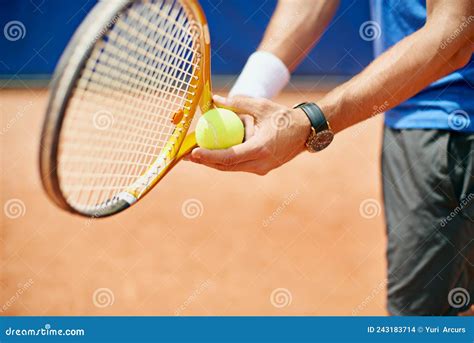 In the Game. Cropped Shot of a Tennis Player Ready To Serve. Stock ...