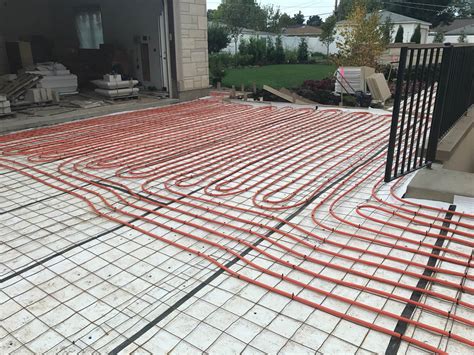 Snow melt system is being installed in the driveway at Mango in Morton Grove - America's Custom ...