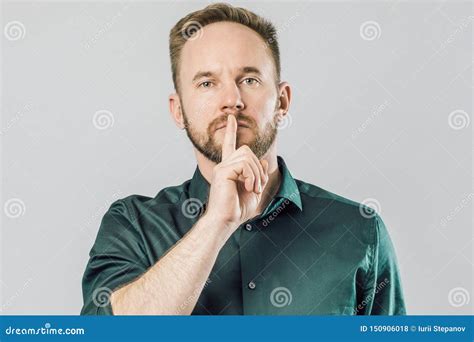 Serious Caucasian Man Holding Index Finger Over Mouth Saying Shh Stock Photo - Image of hush ...