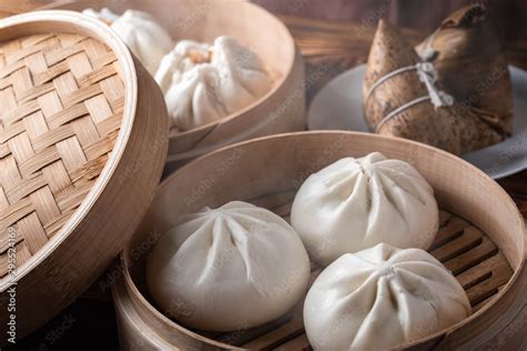 chinese steamed bun in traditional bamboo steamer Stock Photo | Adobe Stock