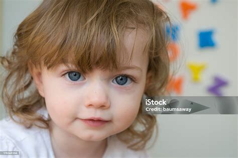 Toddler Girl Blue Eyes Face With Alphabet Letters Stock Photo ...