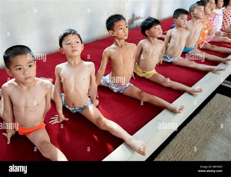 Chinese children do the splits to practice gymnastics at a gymnastics ...