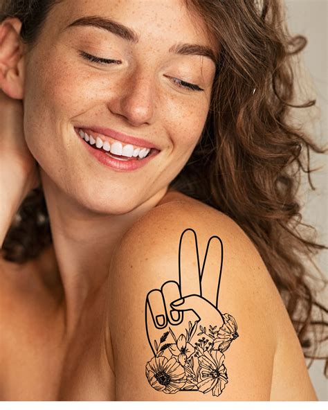 Hand Peace Sign Tattoo