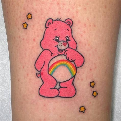 Care bear tattoo located on the shin, hand poked.