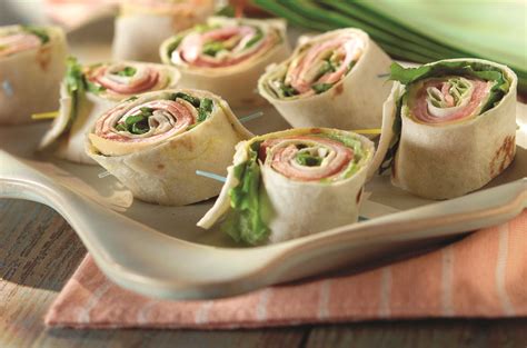 Roll up a party-perfect pinwheel sandwich recipe with ham, turkey ...