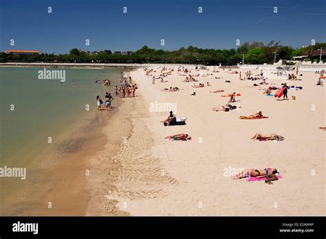 France, Charente Maritime, La Rochelle, tourists on the Plage de la ...