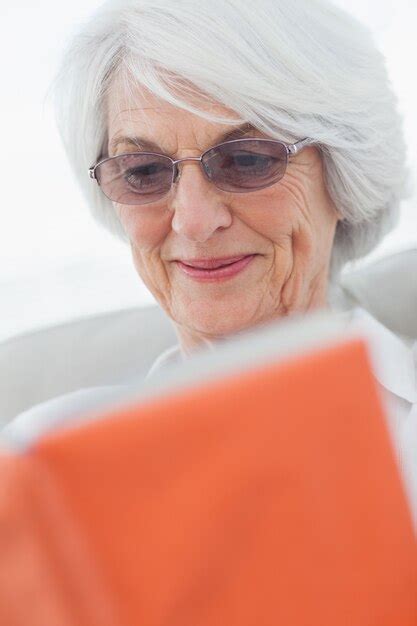 Premium Photo | Retired woman reading a book