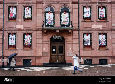 Pirmasens, Germany. 15th Dec, 2020. Two passers-by walk in the ...