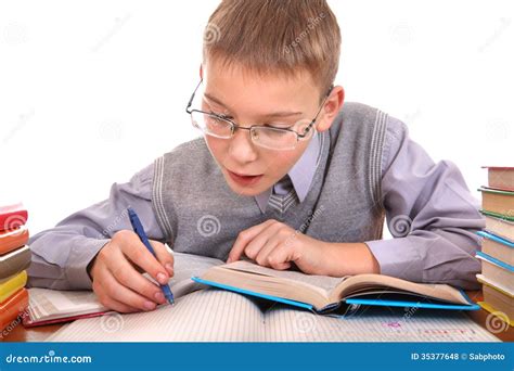Schoolboy writing stock photo. Image of desk, glasses - 35377648