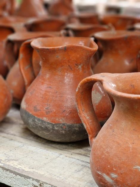 Premium Photo | Clay jugs in a pottery shop, closeup of photo