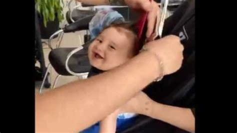 People reacted happily to the reaction that the child gave while getting the hair cut. This cute ...