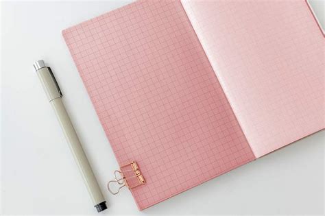 Blank plain pink notebook page with stationary mockup