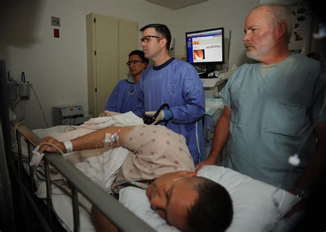 File:US Navy 110405-N-KA543-028 Hospitalman Urian D. Thompson, left, Lt. Cmdr. Eric A. Lavery ...