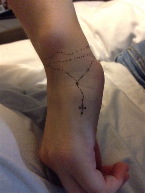 Rosary tattoo, Rosary foot tattoos, Wrist tattoos for guys