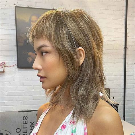 Have you been seeking the most stylish wolf cuts with bangs for a fresh makeover? This wolf shag ...