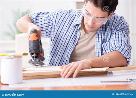 The Young Man in Woodworking Hobby Concept Stock Photo - Image of assembling, board: 117405634