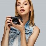 Blond female photographer Stock Photo by ©fxquadro 118454836
