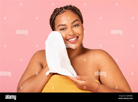 Plus Size Black Woman Drying Face With Towel, Pink Background Stock Photo - Alamy
